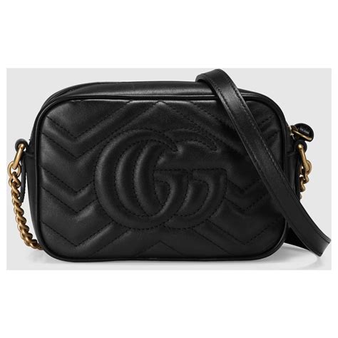 Gucci Mini sac GG Marmont bicolore avec chaîne.